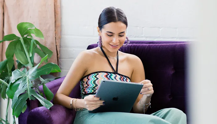 A woman reviewing plan details on a tablet