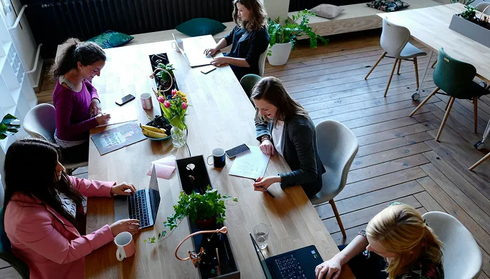 A team collaborating around a large shared table